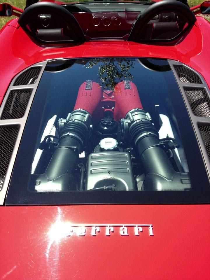 Black Ice Details & Coatings | The engine of a red Ferrari is visible through the windshield