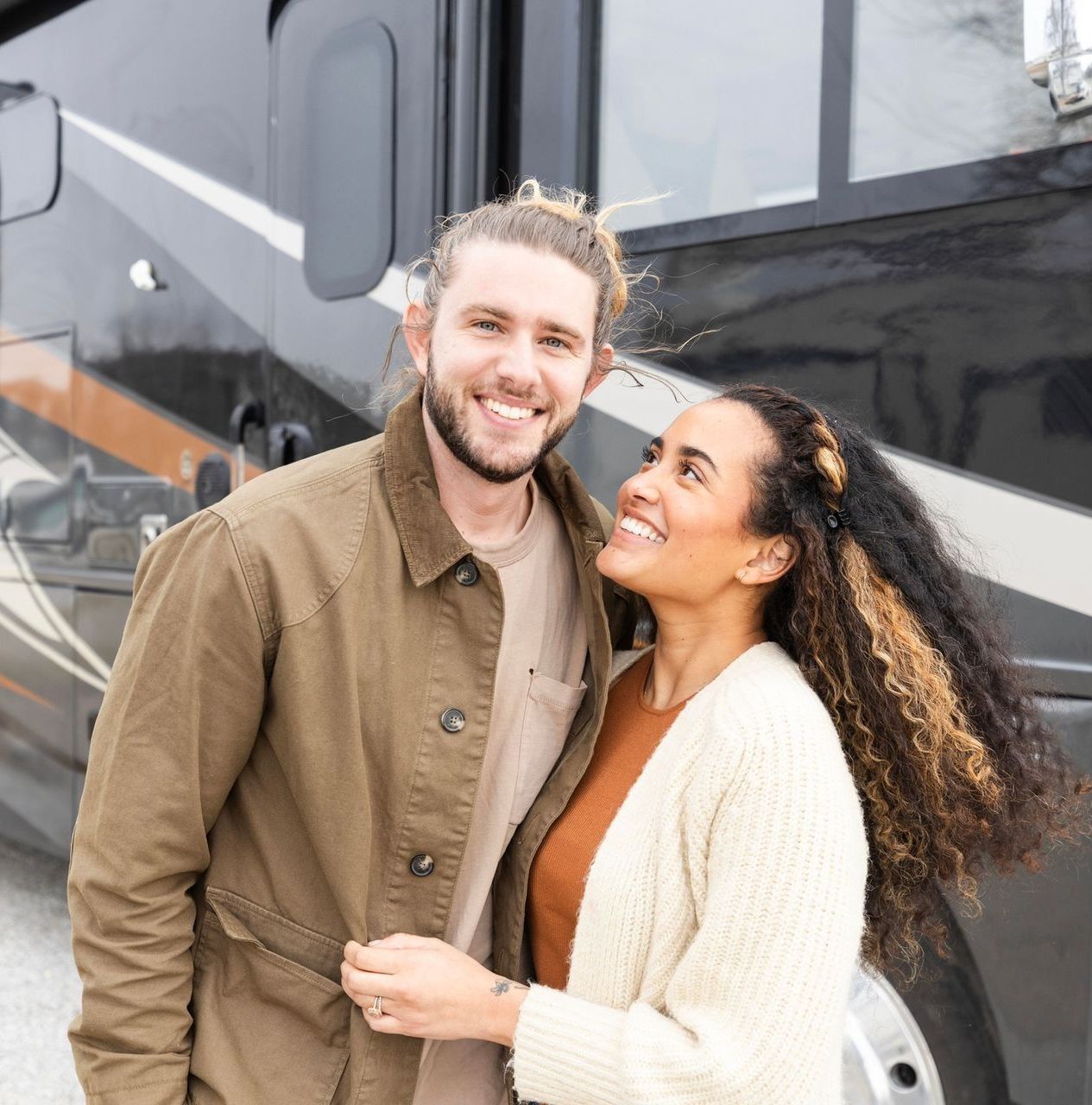Two Women Are Sitting On The Back Camper — Boise, ID — Boise Valley RV Center Two Women Are Sitting On The Back Camper — Boise, ID — Boise Valley RV Center