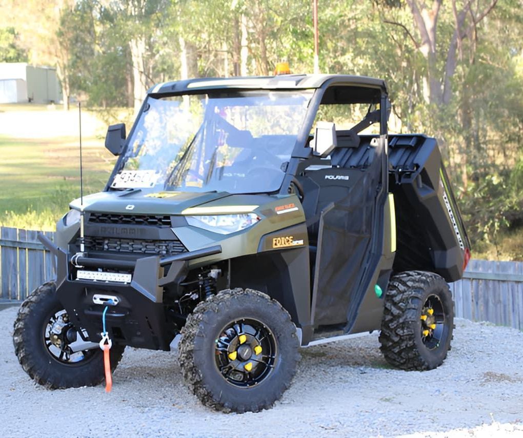 A Polaris Utility Vehicle Is Parked In A Gravel Lot. — Forcequip Hire In Southside, QLD