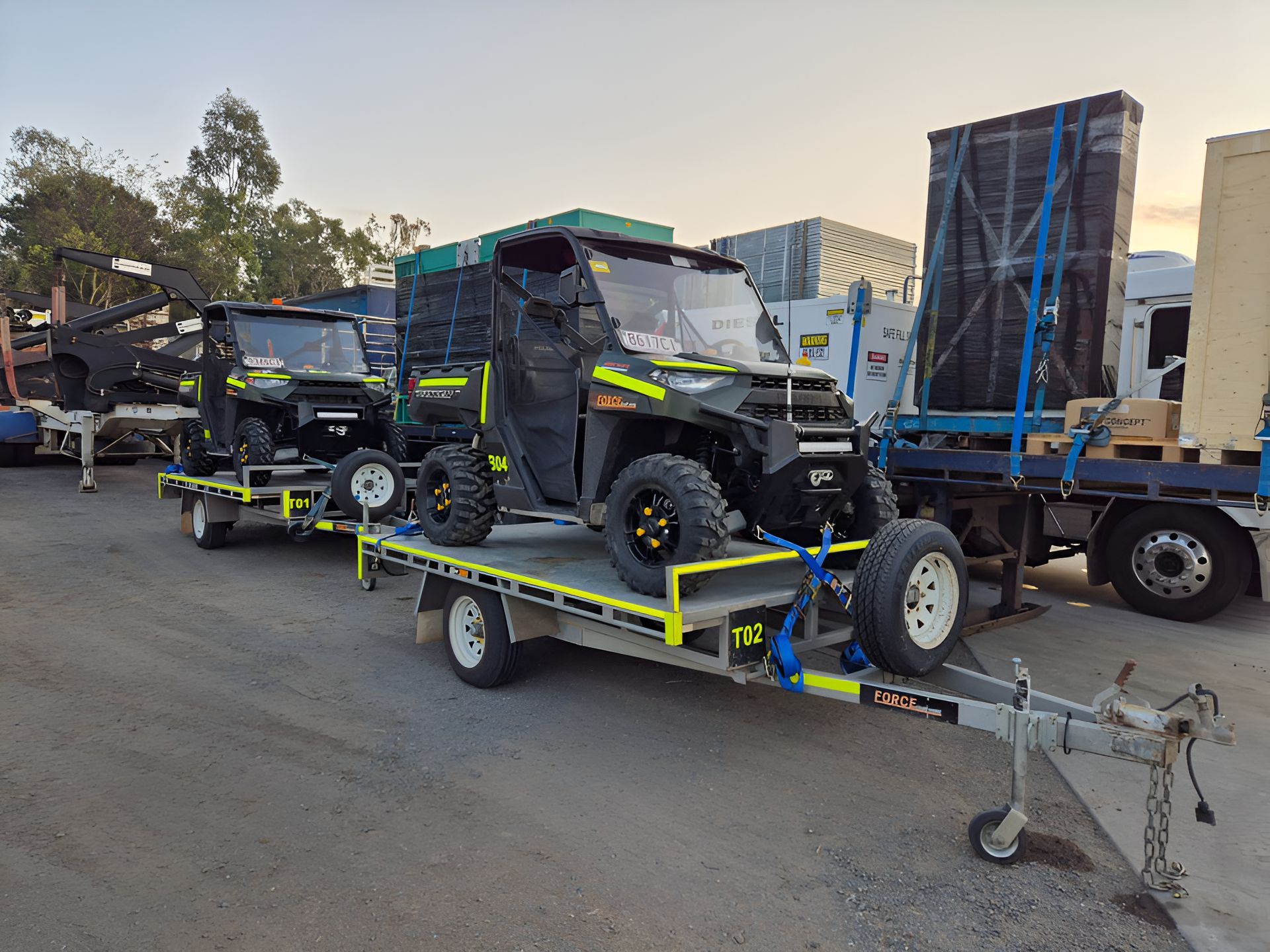 A Row Of ATV Are Sitting On Top Of A Trailer  — Forcequip Hire In Southside, QLD