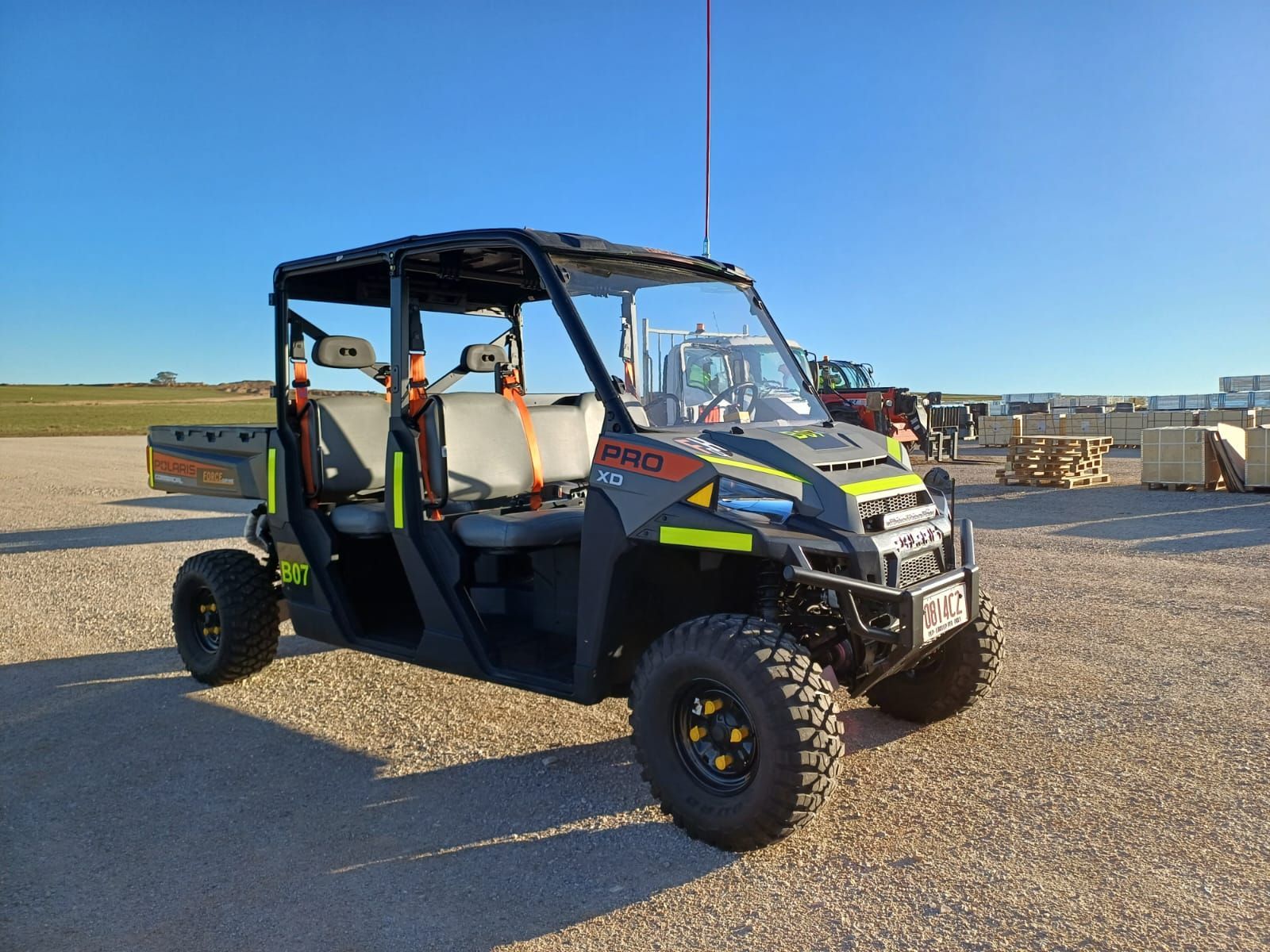 A Polaris Utility Vehicle Is Parked In A Gravel Lot — Forcequip Hire In Southside, QLD