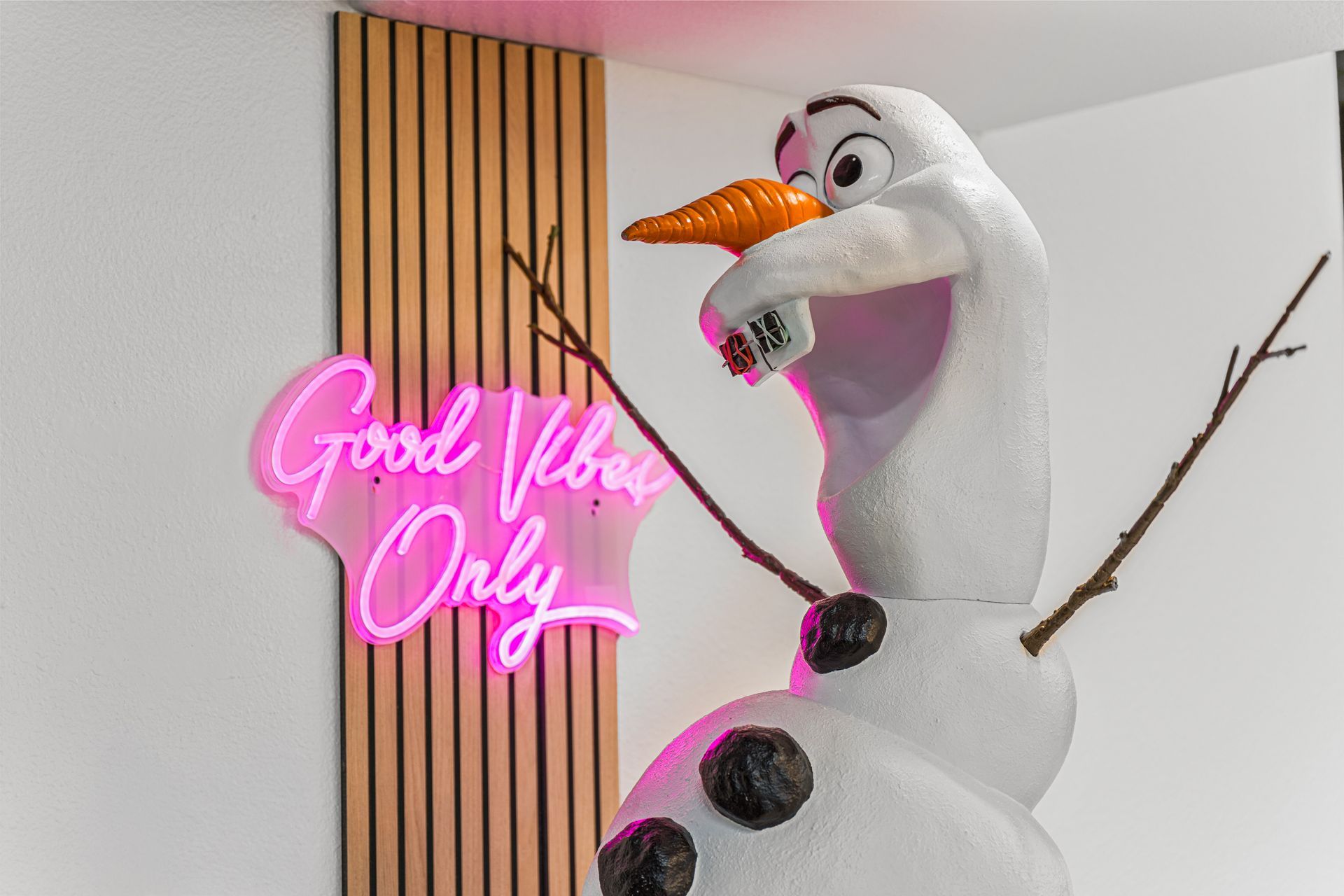 Lucent Orthodontics, San Antonio. A large Olaf snowman figure stands next to a pink 