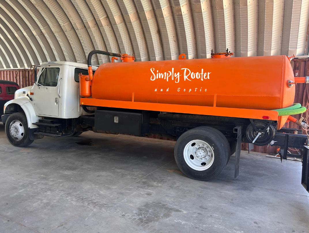 White work truck with orange tank, 