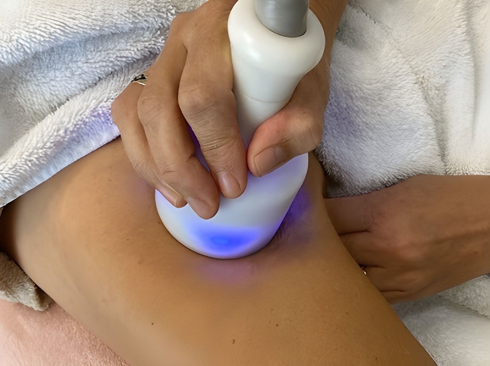 A Woman is Getting a Ultrasonic Treatment on Her Leg — Your Body Revolution in Caloundra, QLD