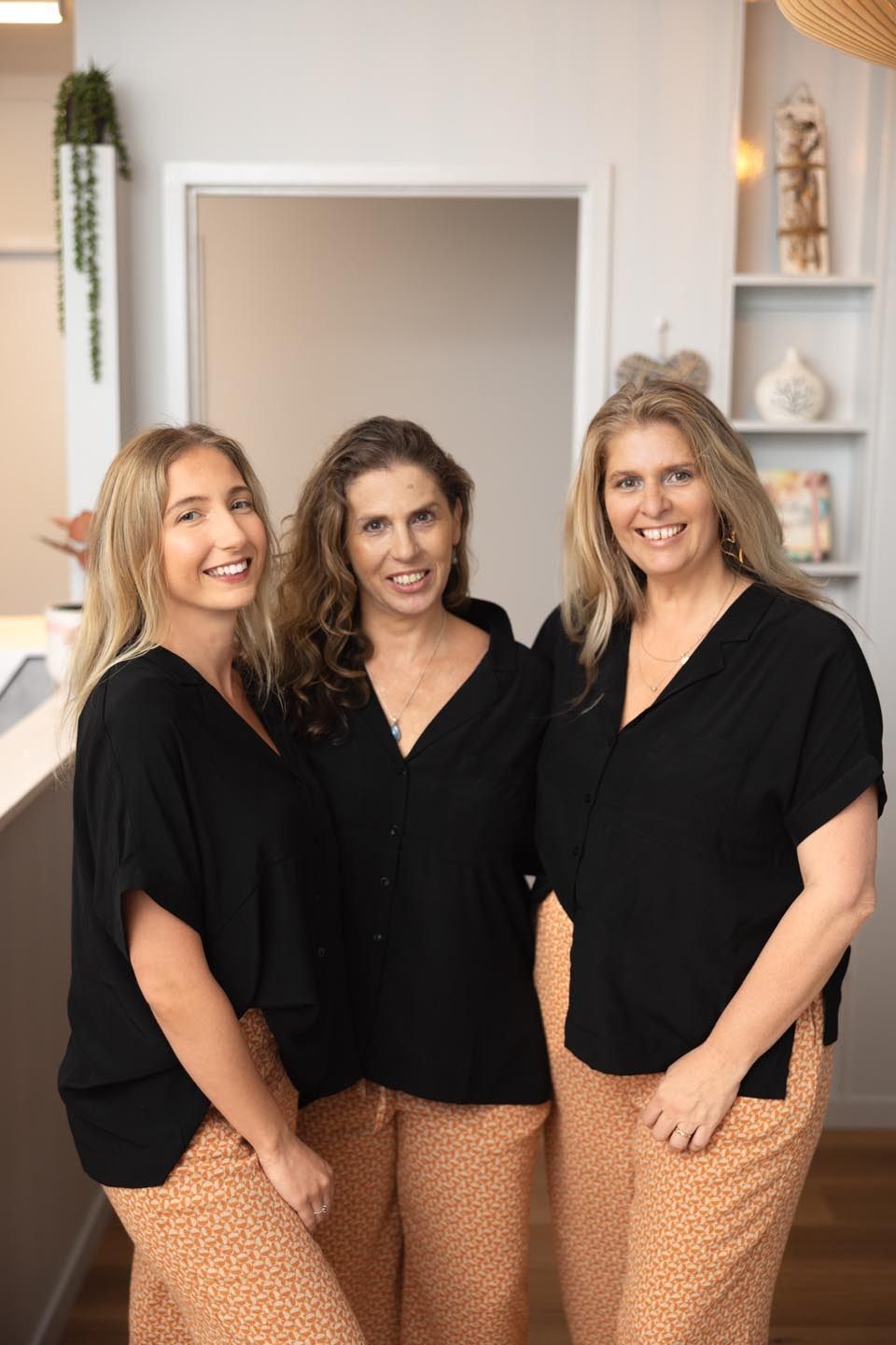Three Women Are Posing for a Picture Together in a Room β Your Body Revolution in Caloundra, QLD