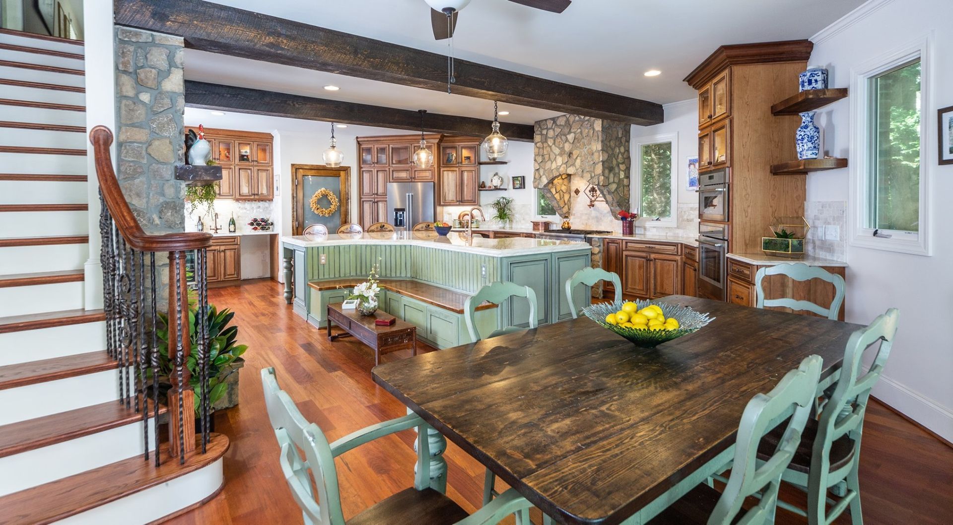 There is a dining table and chairs in the middle of the room.