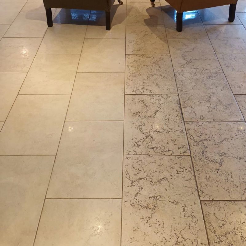 Two chairs are sitting on a tiled floor