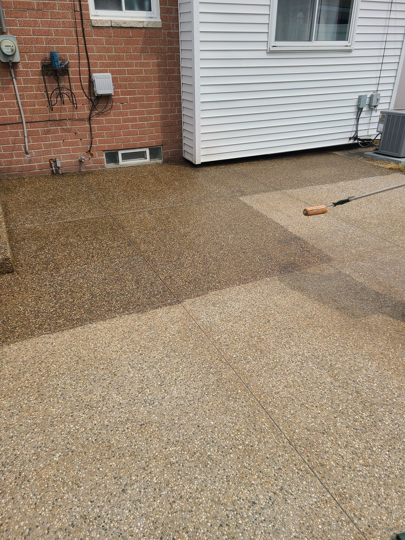 A living room with a staircase leading up to the second floor.