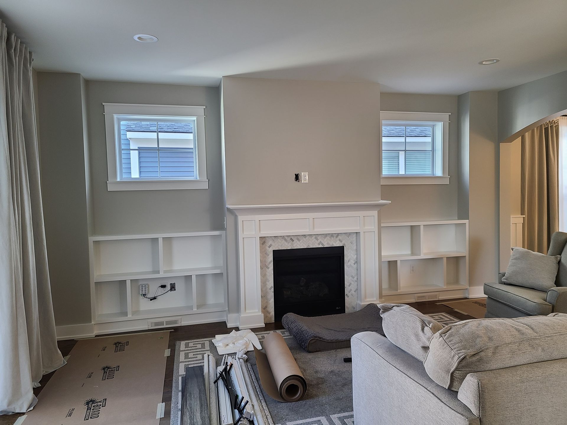 A living room with a fireplace and a couch