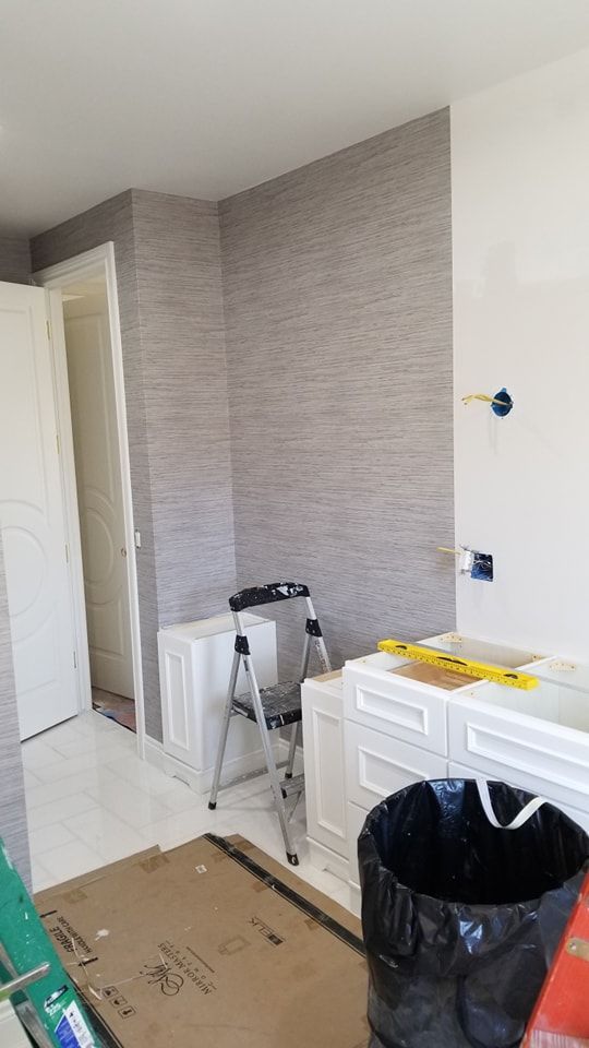 A bathroom with a bathtub and a ladder in it.