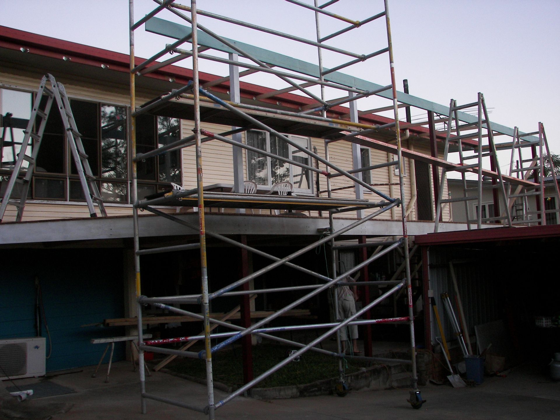 Scaffolding is being built on the side of a building