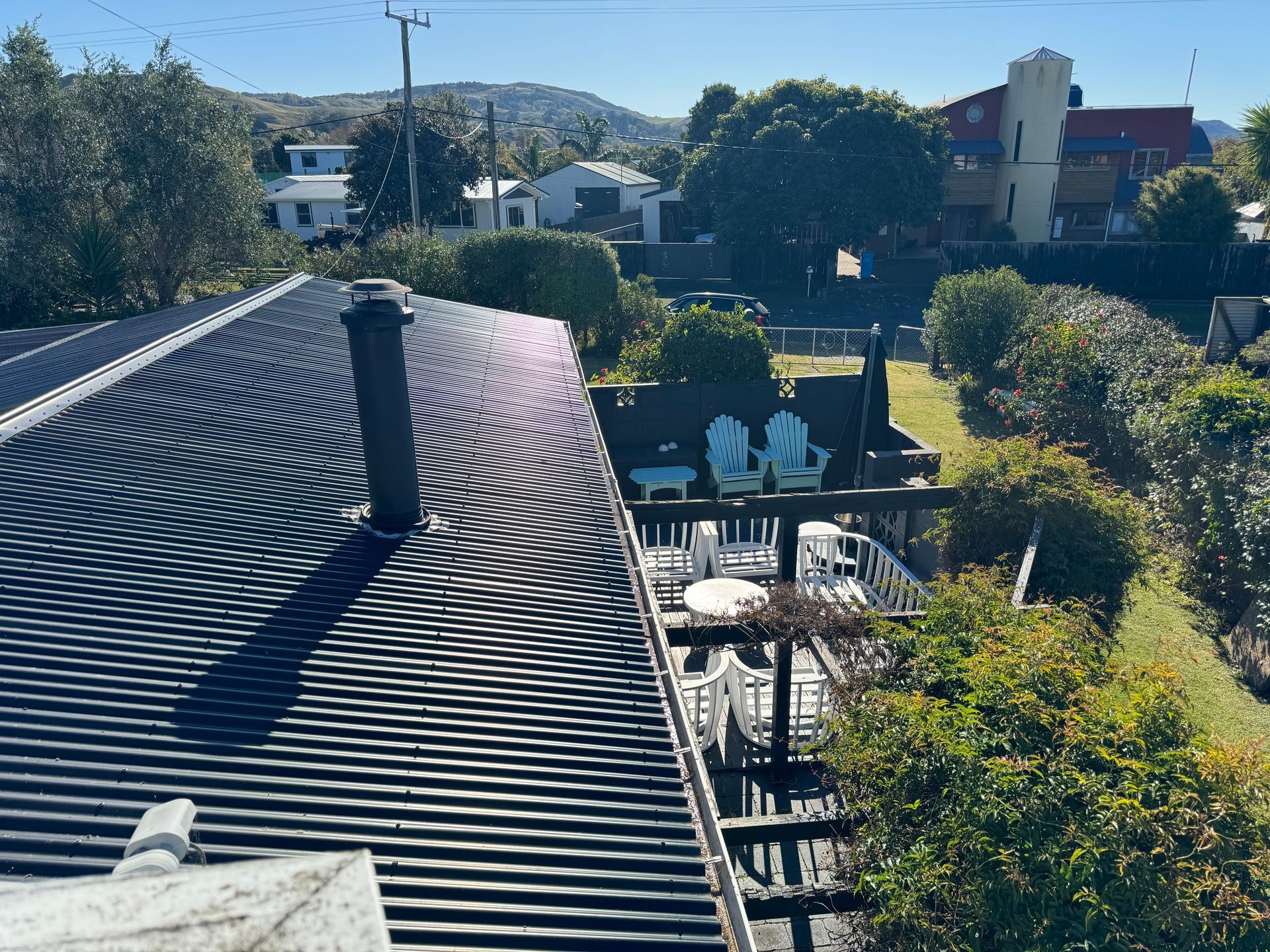 The roof of a house with a chimney on it