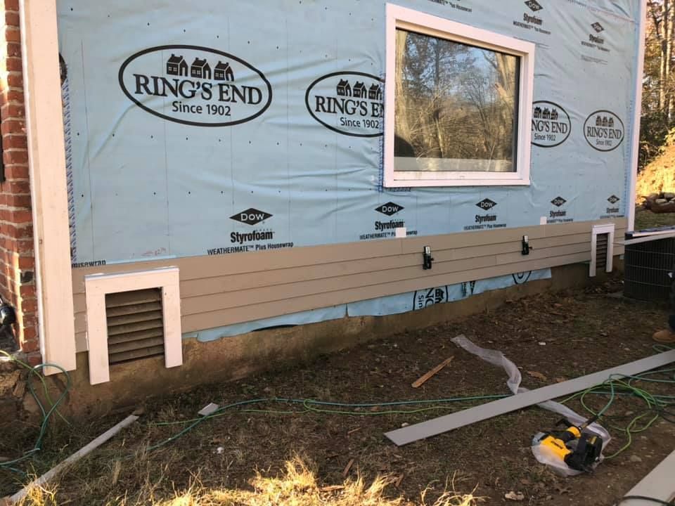 A house is being remodeled with ring 's end siding.