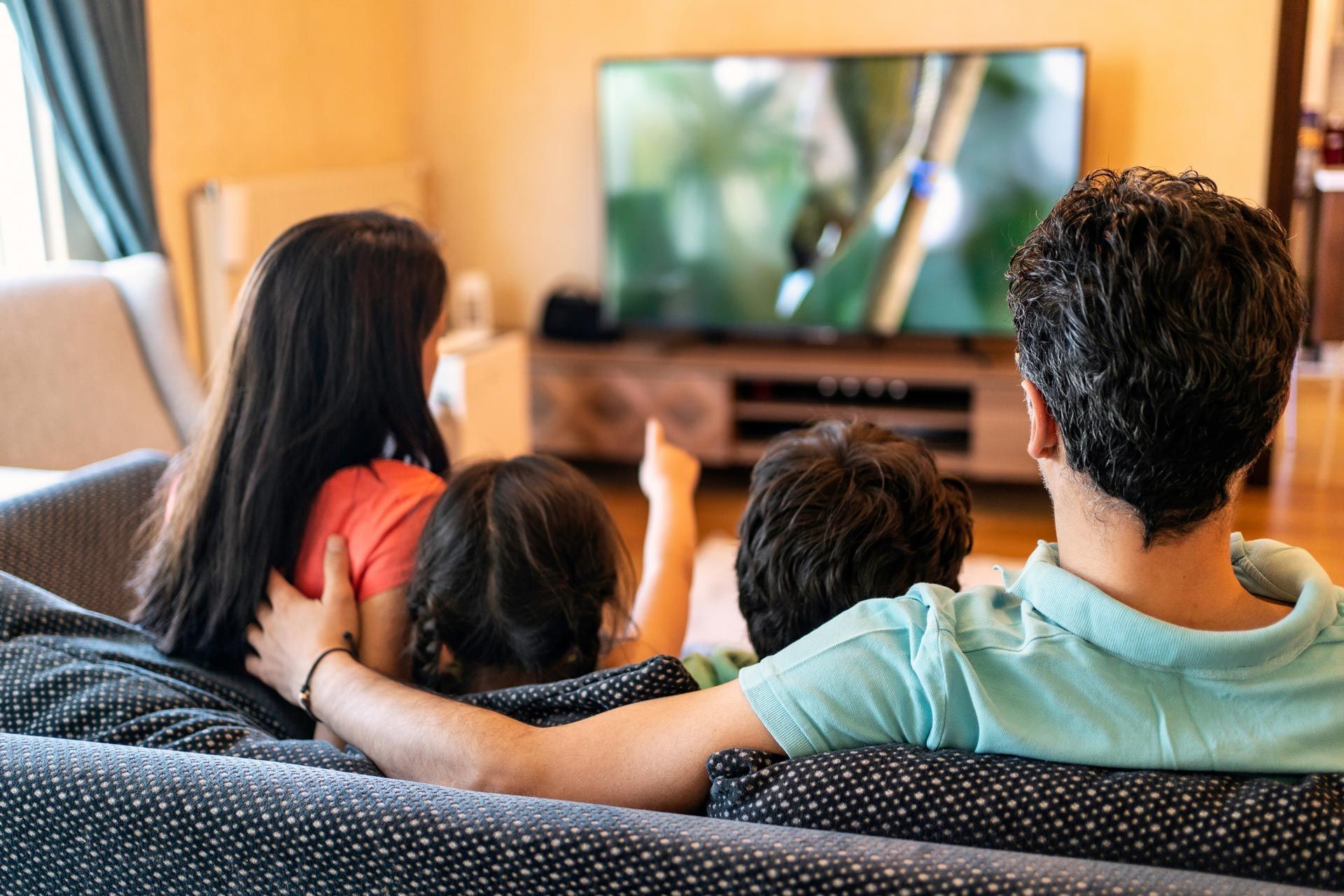 Parents and Their Two Children Watching TV Together at Home | Mildura, Vic | a & R Electronics