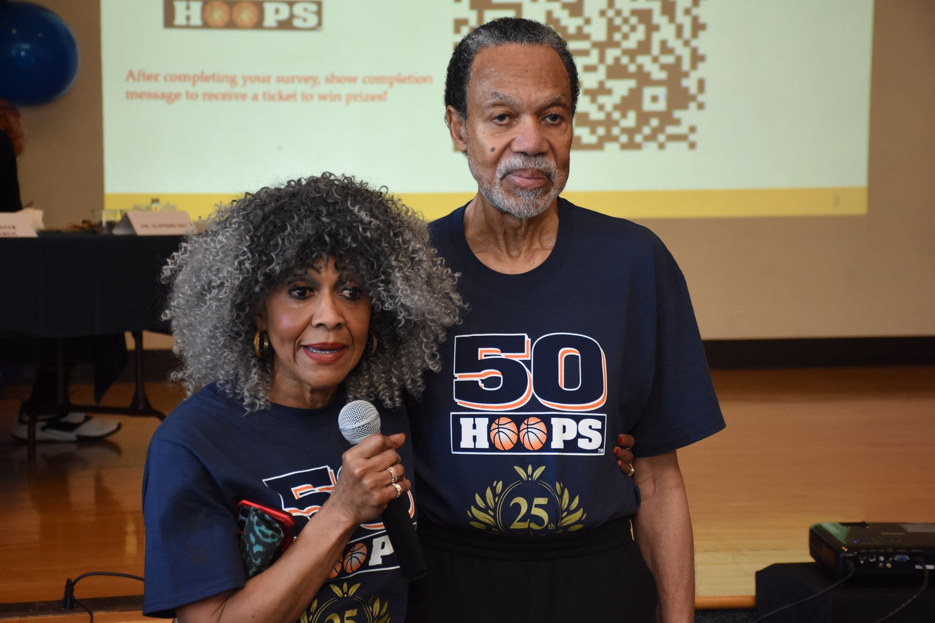 Couple, wearing matching blue 