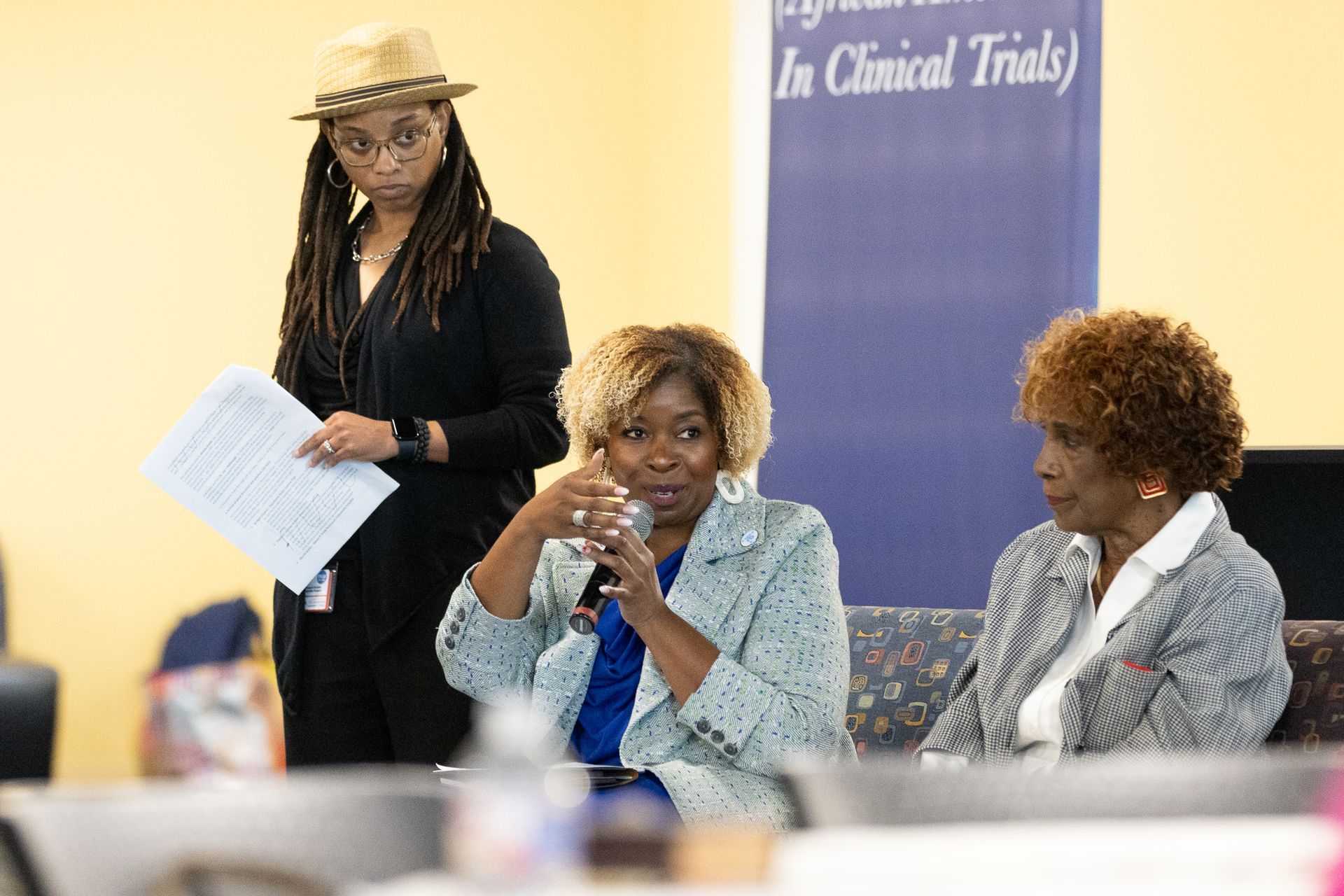 Three women at a panel discussion