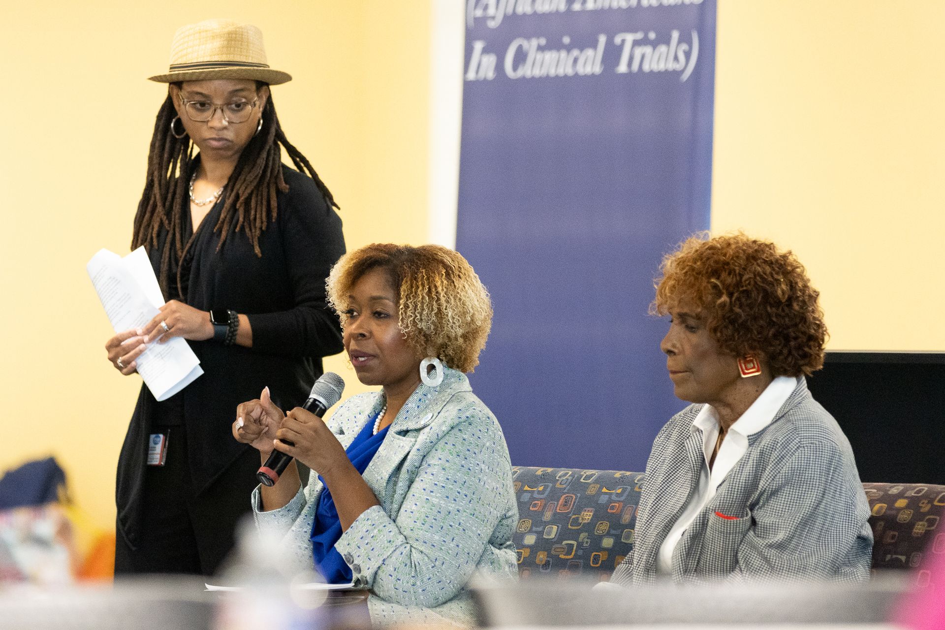 Three women at a panel discussion
