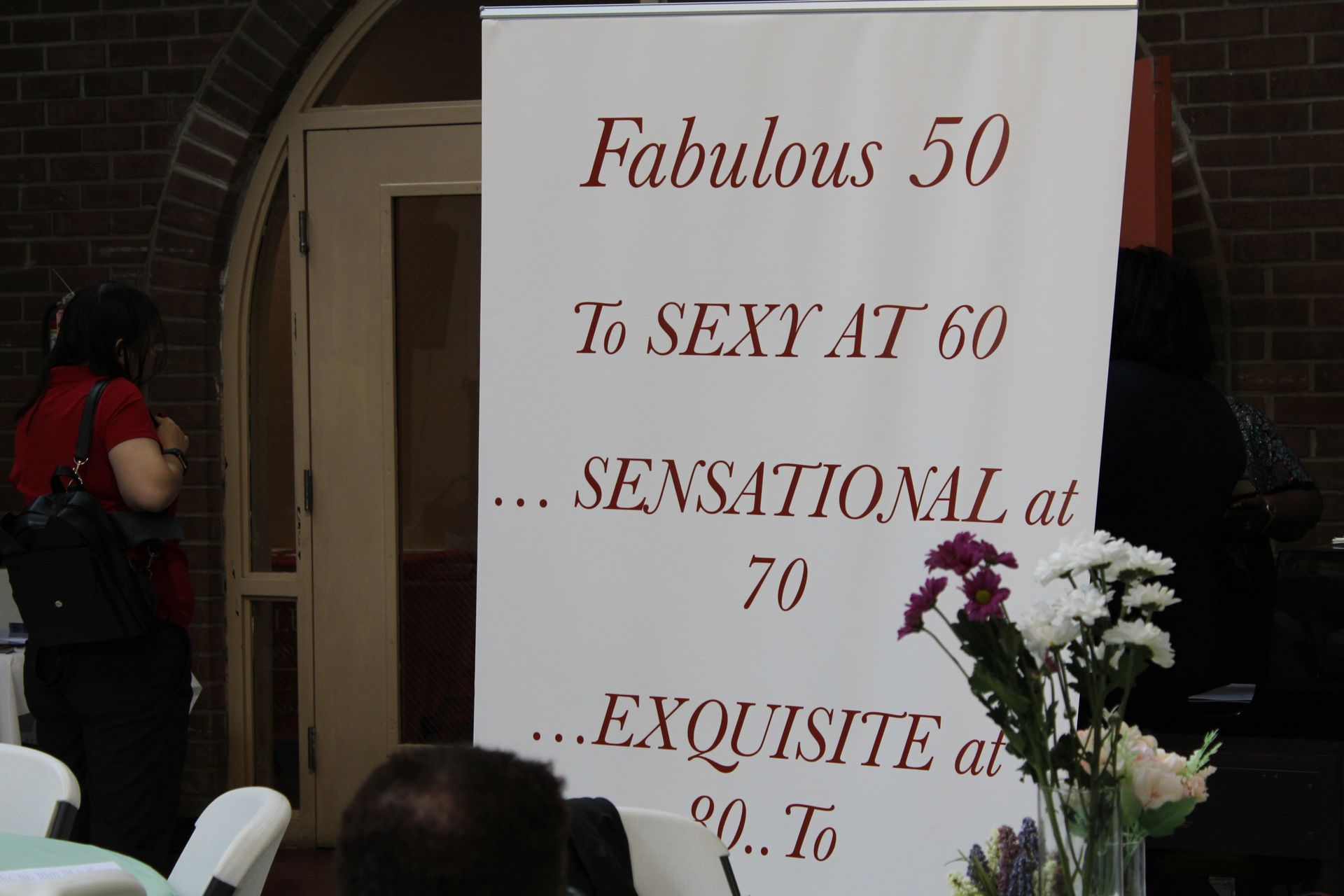 White banner with burgundy text