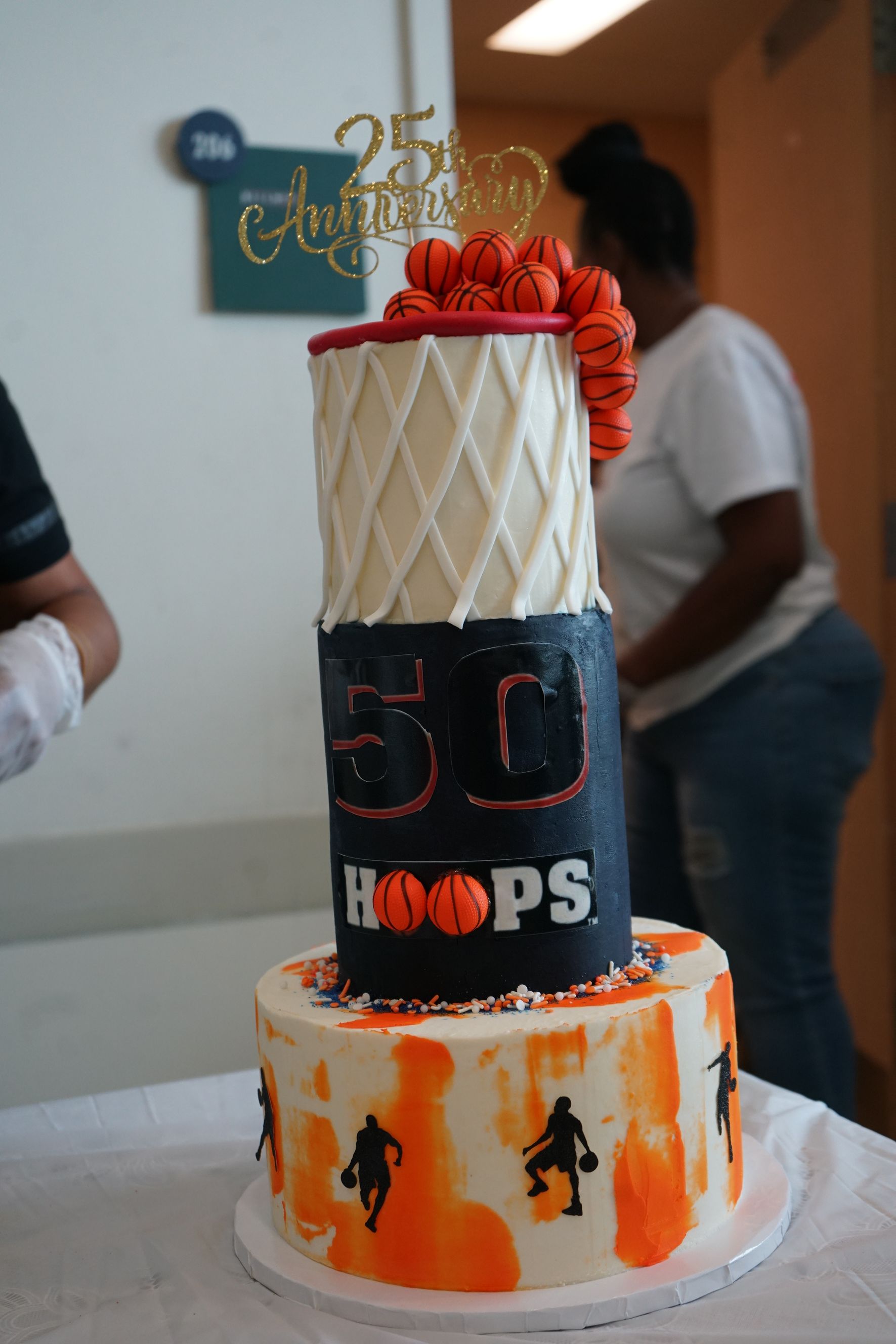 Three-tiered basketball-themed cake celebrating 25th anniversary