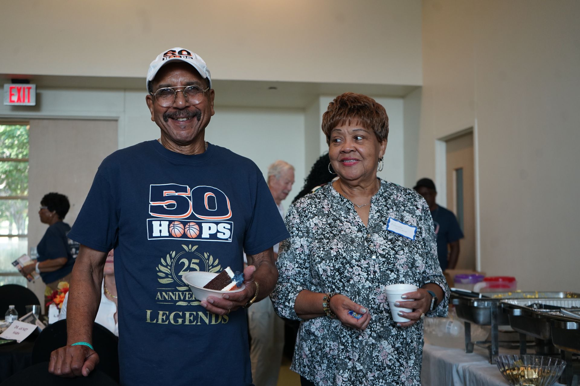 Couple at an event, man in a 