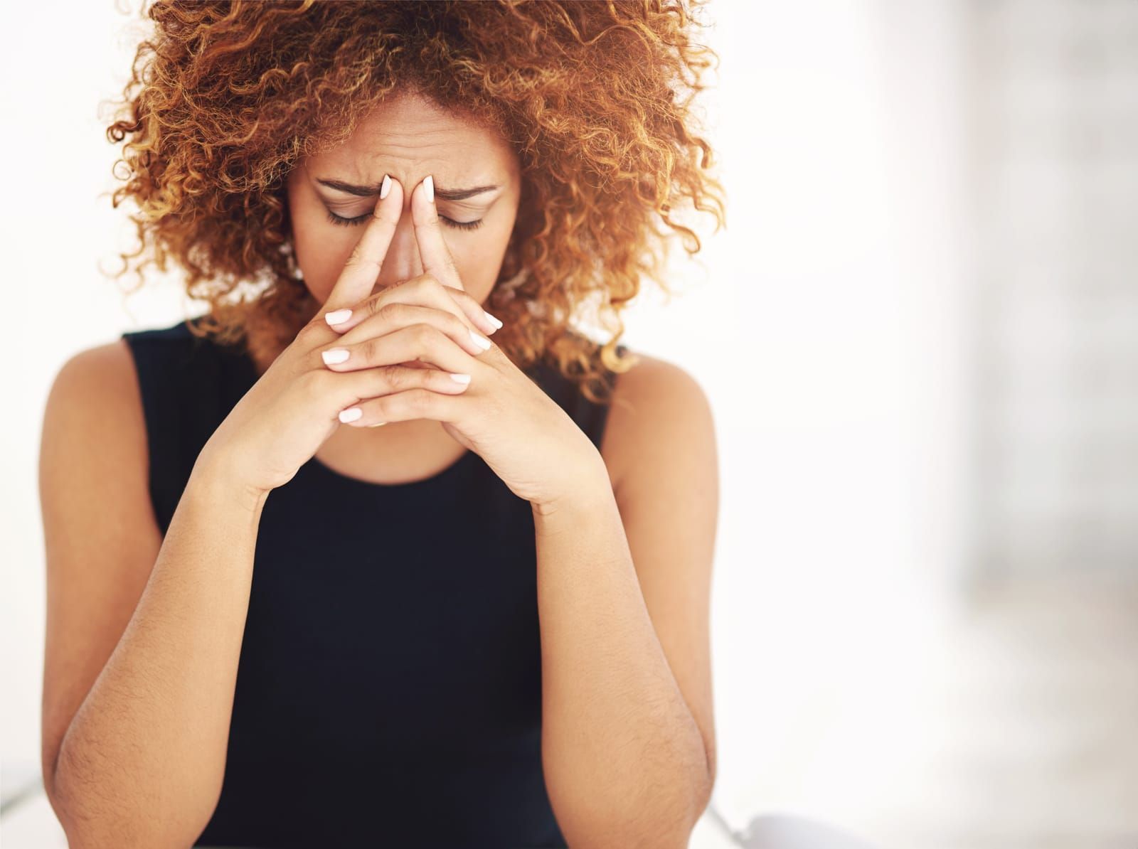 A woman suffering from sinus pressure