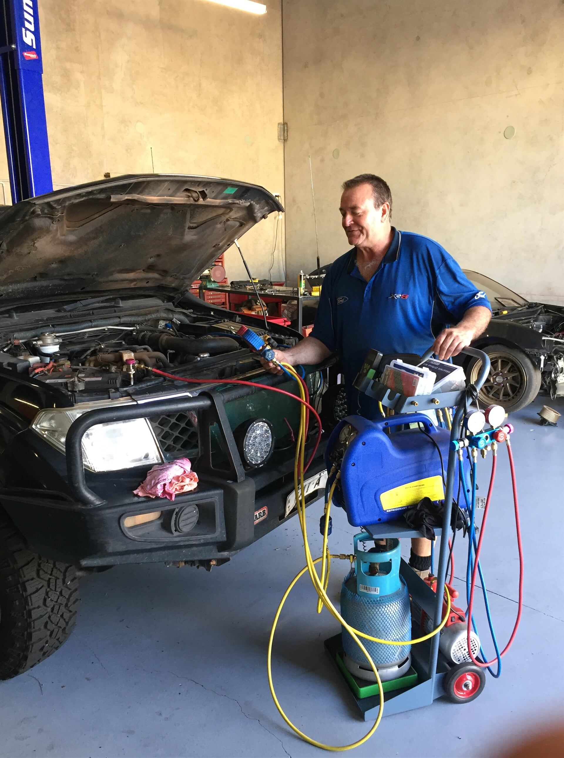 Mechanic Testing Car Air Conditioner — Mechanic in Berrimah, NT