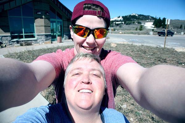 A man and a woman are taking a selfie together