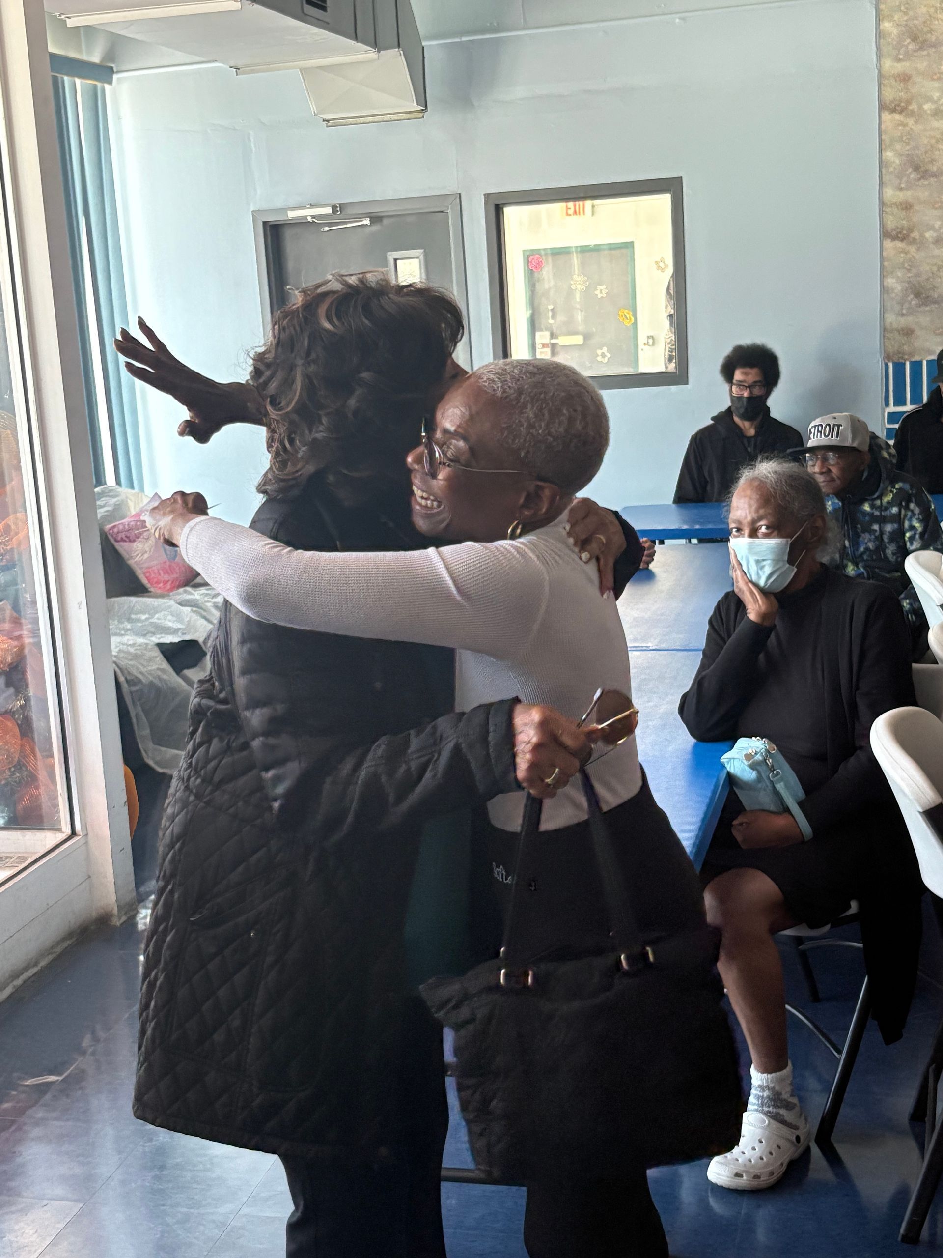 Medical worker helping his patient to move around