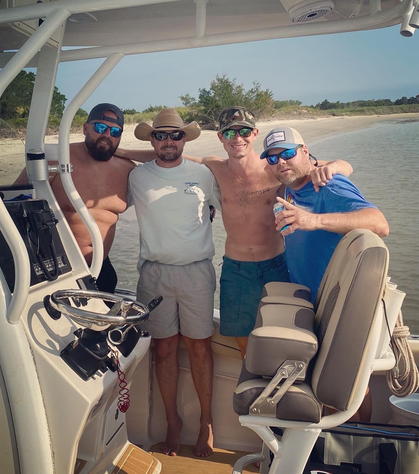 A group of men are posing for a picture on a boat