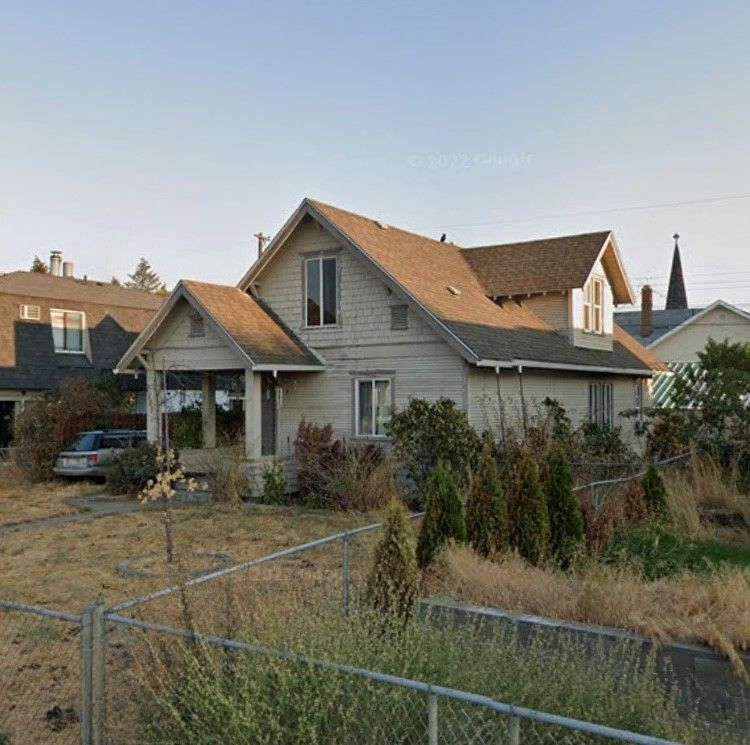 A house with a fence in front of it