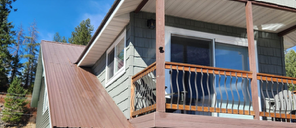 A house with a porch and a sliding glass door