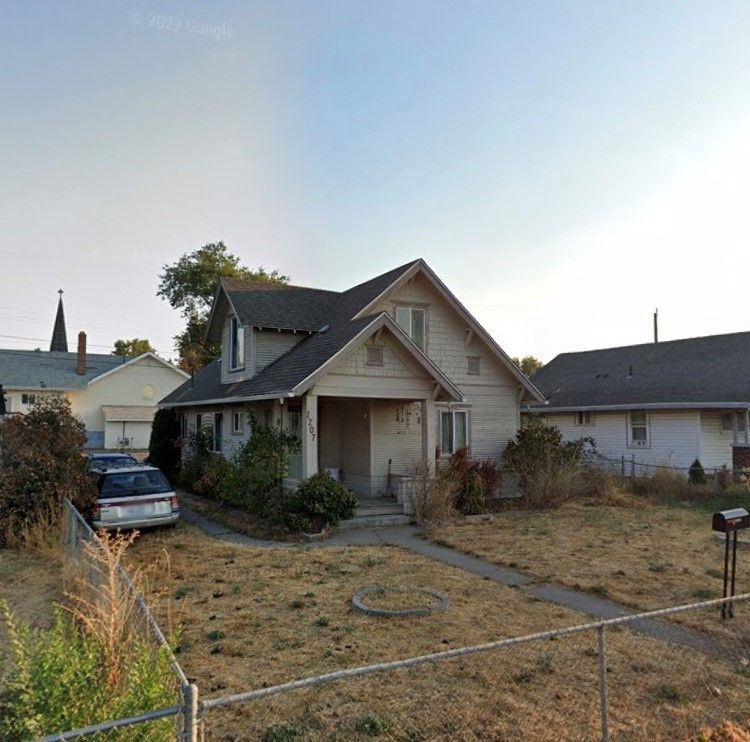 A house with a mailbox in front of it