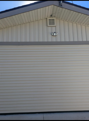 A garage door with a light on the side of it