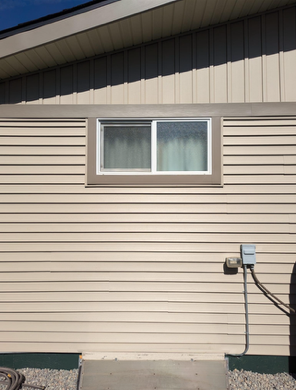 A house with a window on the side of it