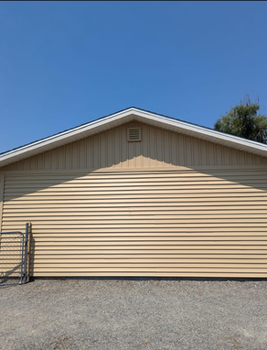 A tan house with a blue sky in the background