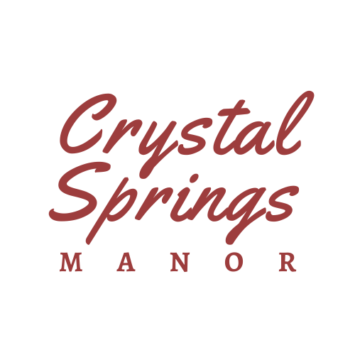 Crystal Springs Manor logo in burgundy script on a white background