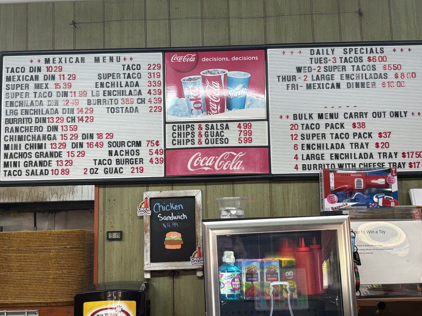 Menu board with Mexican food options and daily specials displayed in a restaurant.
