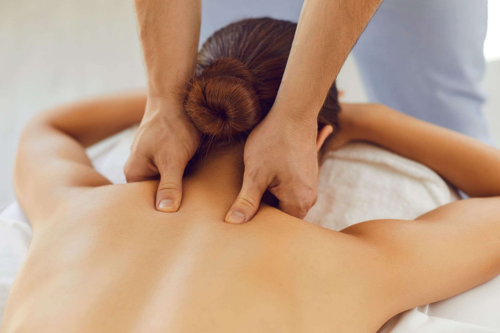 A woman is getting a massage at a spa.