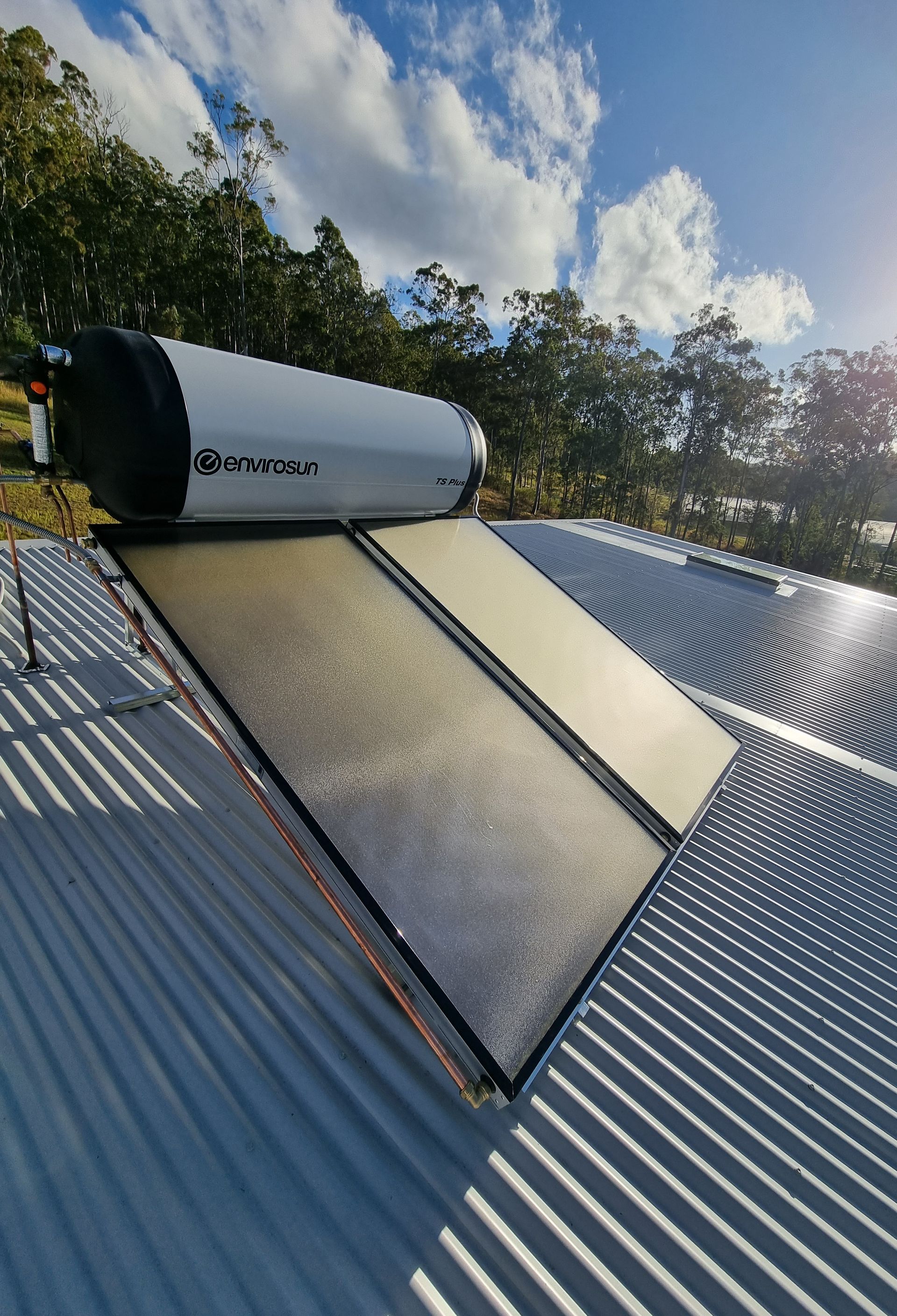 Solar Water Heater on A Corrugated Metal Roof — Hills 2 Ocean Plumbing in Iluka, NSW