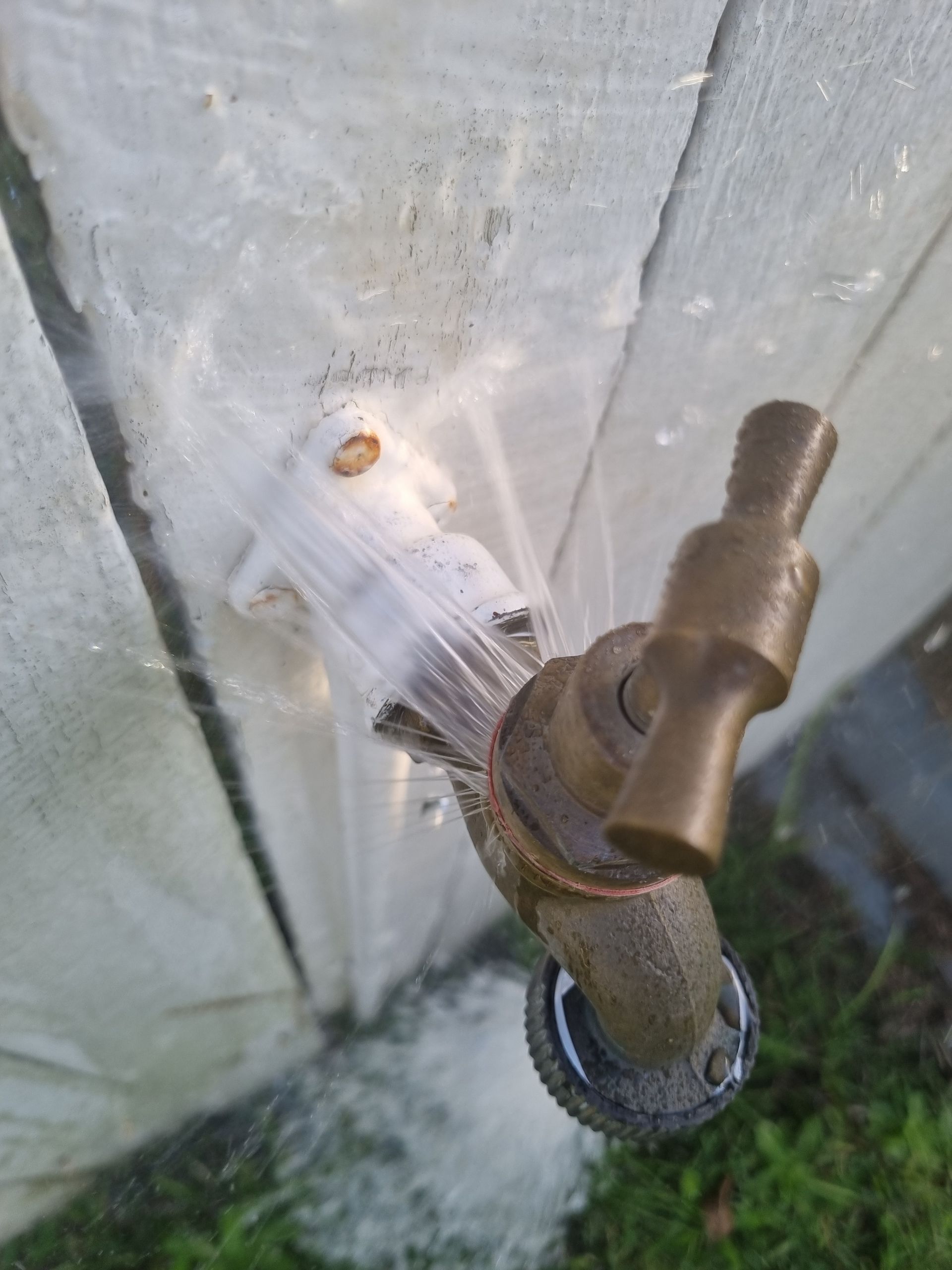 A Spigot on A Wooden Surface Is Gushing Water — Hills 2 Ocean Plumbing in Iluka, NSW