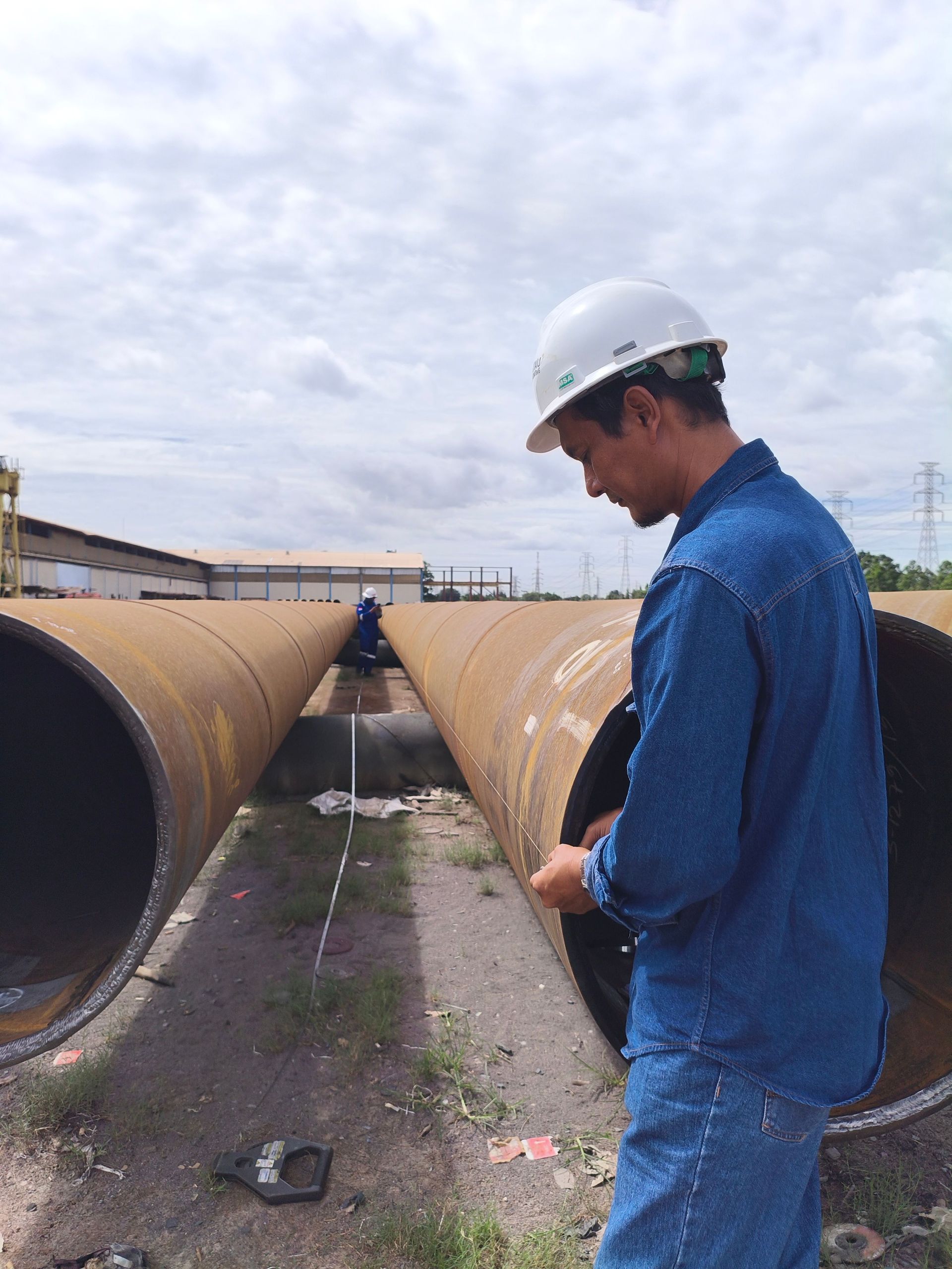 worker on oil pipeline