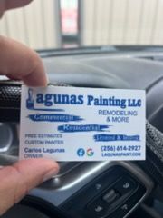 Business card for Lagunas Painting LLC, held in a hand, listing services, contact info, and the owner.
