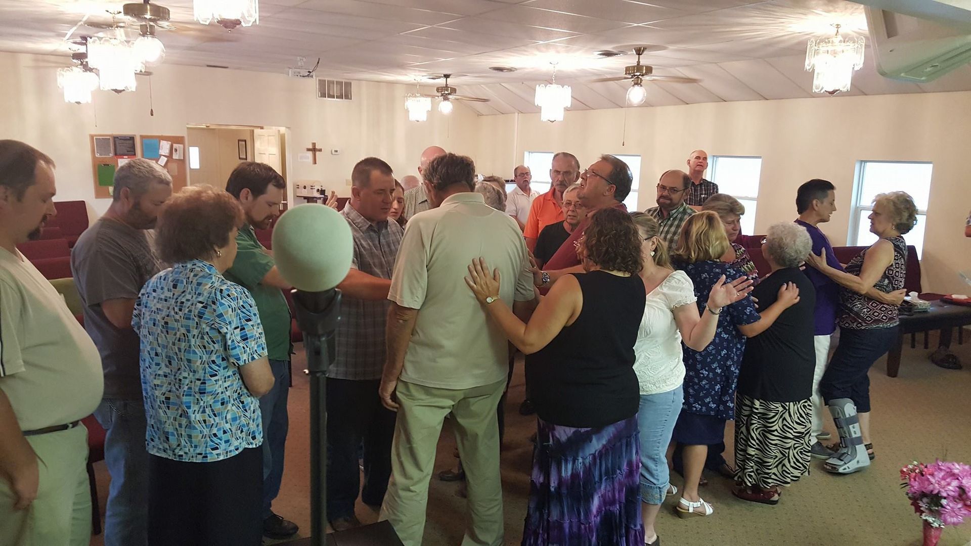 A large group of people are dancing in a room.