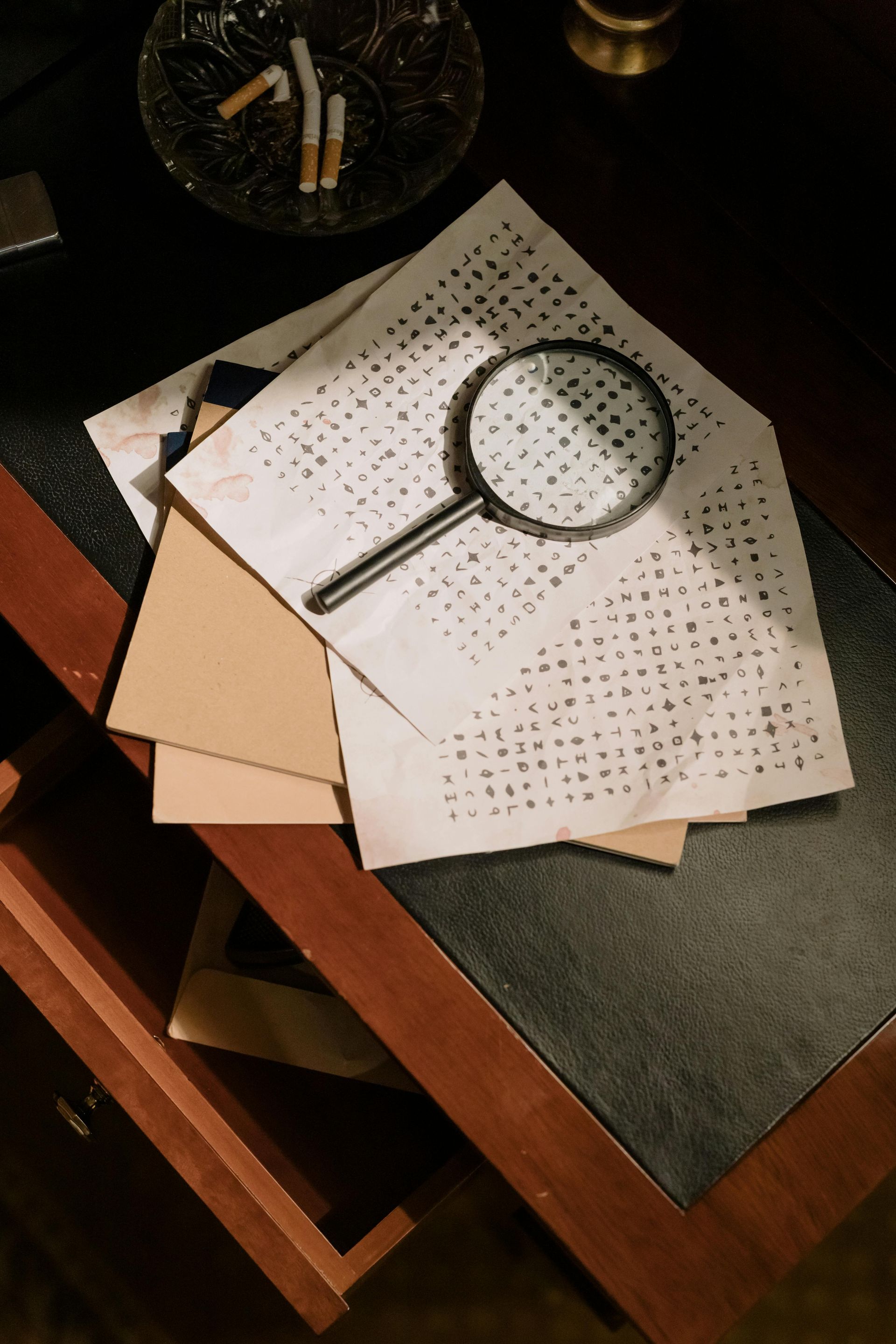 Image of a magnifiying glass on paper connected to copy about marketing analysis in Lior's approach