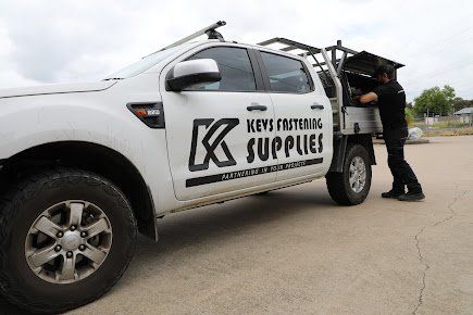 Kevs supply truck with employee working | Kev's Fasteners & Construction Supplies