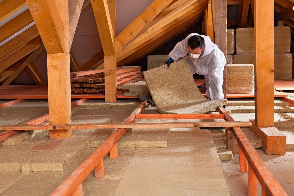 Professional Installing Commercial Floor Insulation in Roof