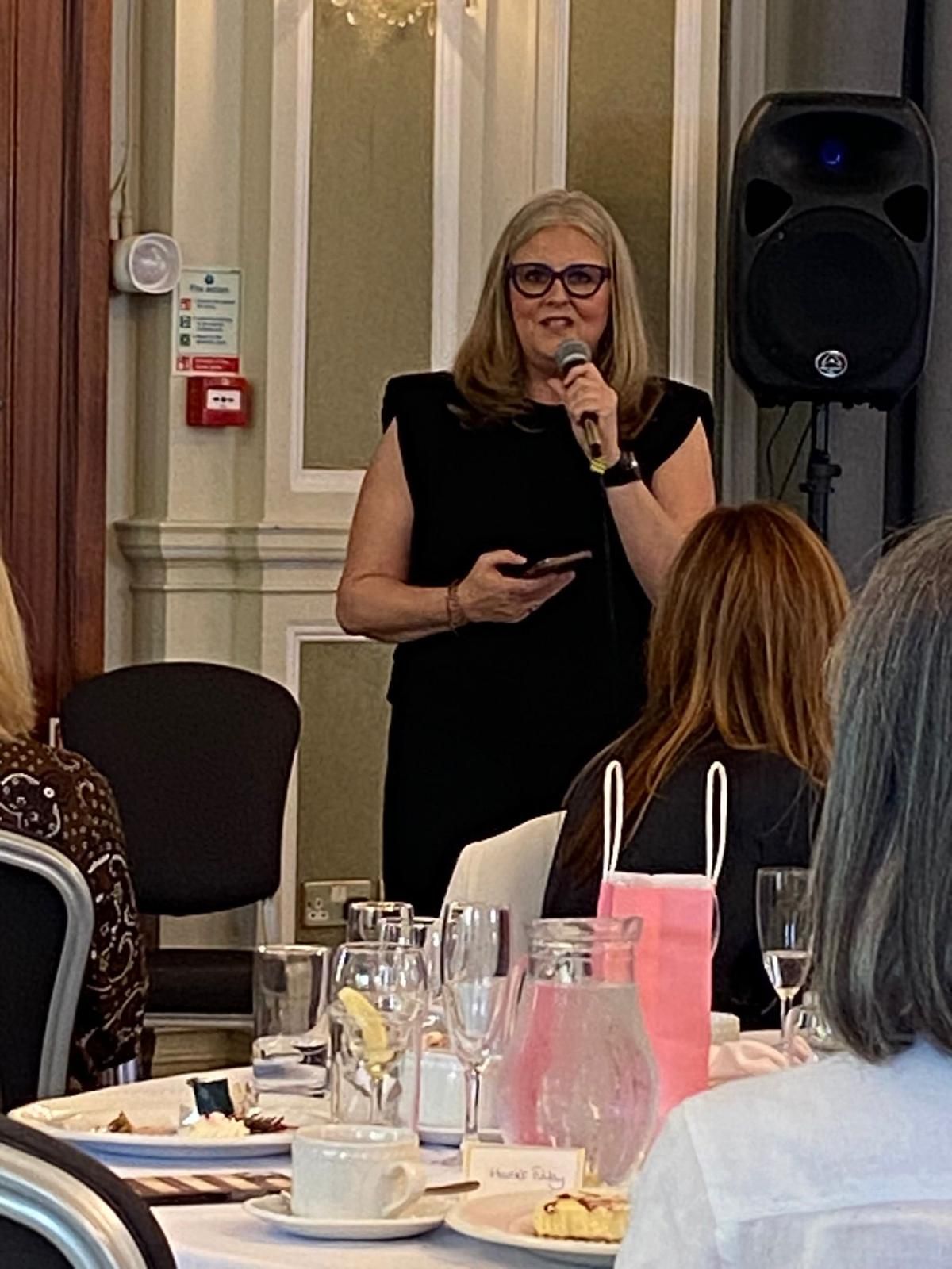 A picture of Tracey Woodward speaking at a Friends of Alfie Martin charity lunch
