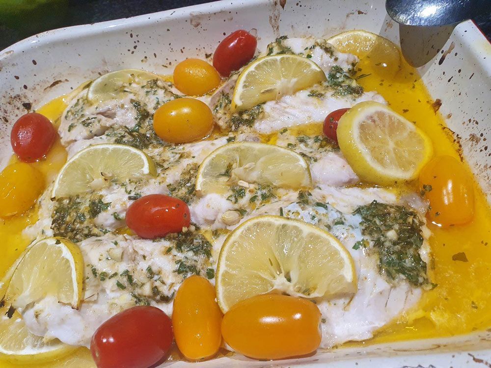 Baked Fish with lemon and cherries toppings— Seafood Platter in Portsmith, QLD