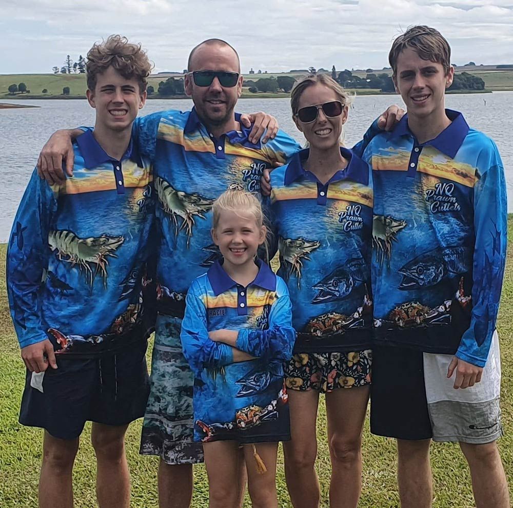 Team wearing NQ Prawn Cutlet tshirt beside a lake— Local Seafood Shop in Portsmith, QLD