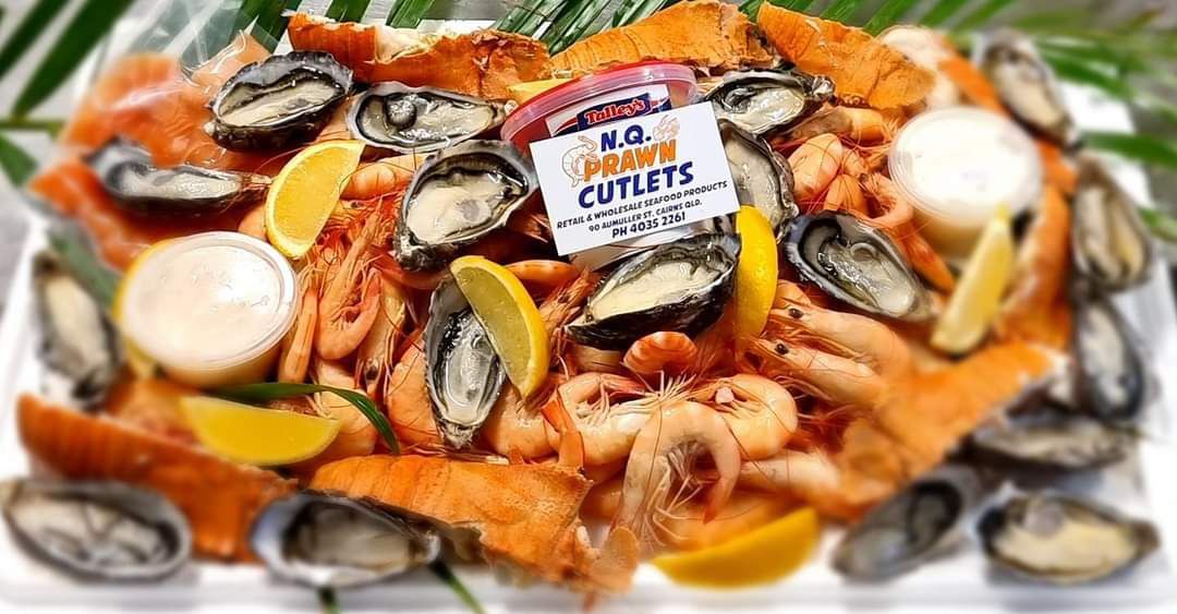 Tasty Mussels And Prawns with lemon and NQ Prawn cutlet tag on it  — Seafood Platter in Portsmith, QLD